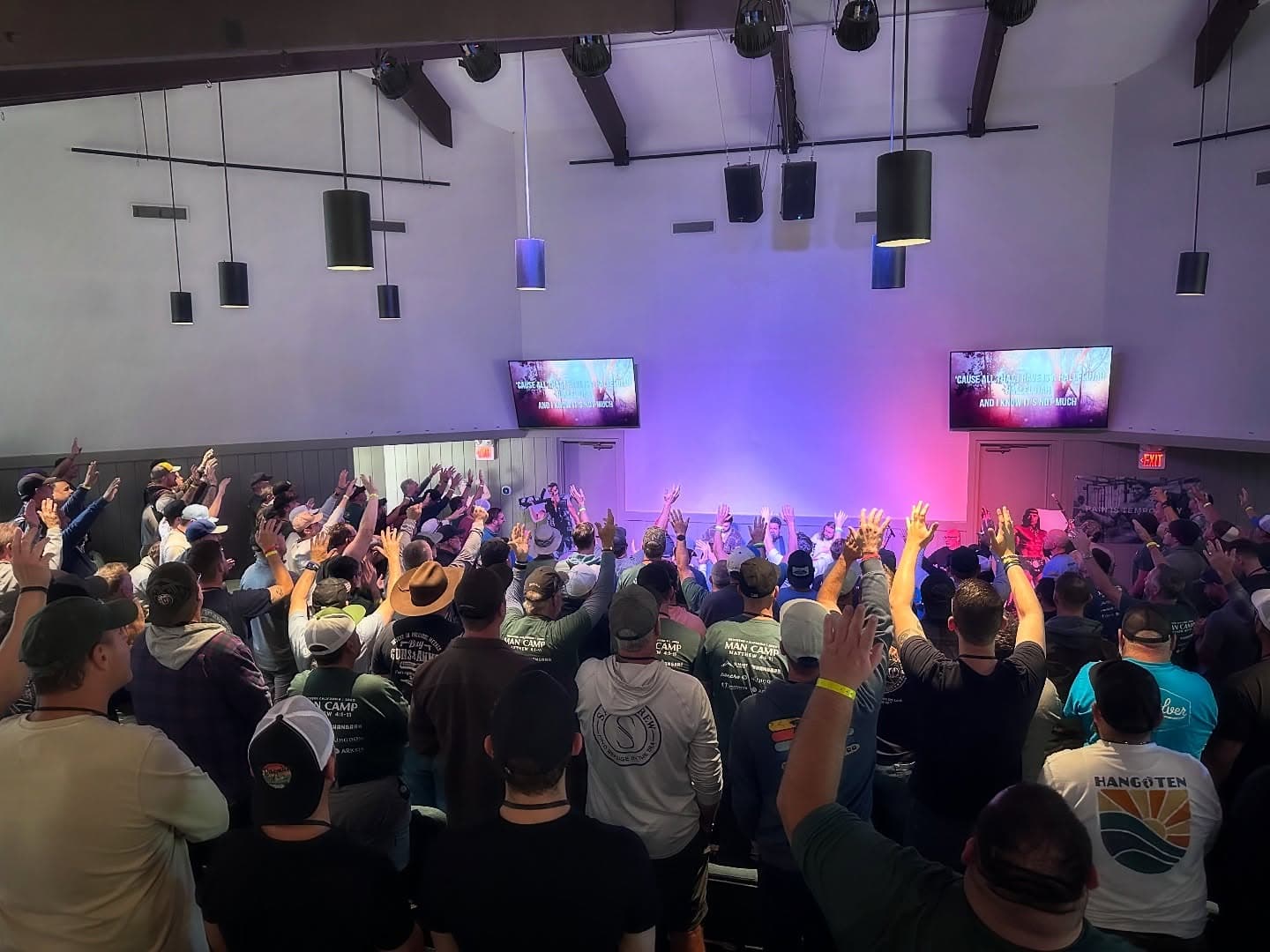 Hundreds of men worshiping at Man Camp